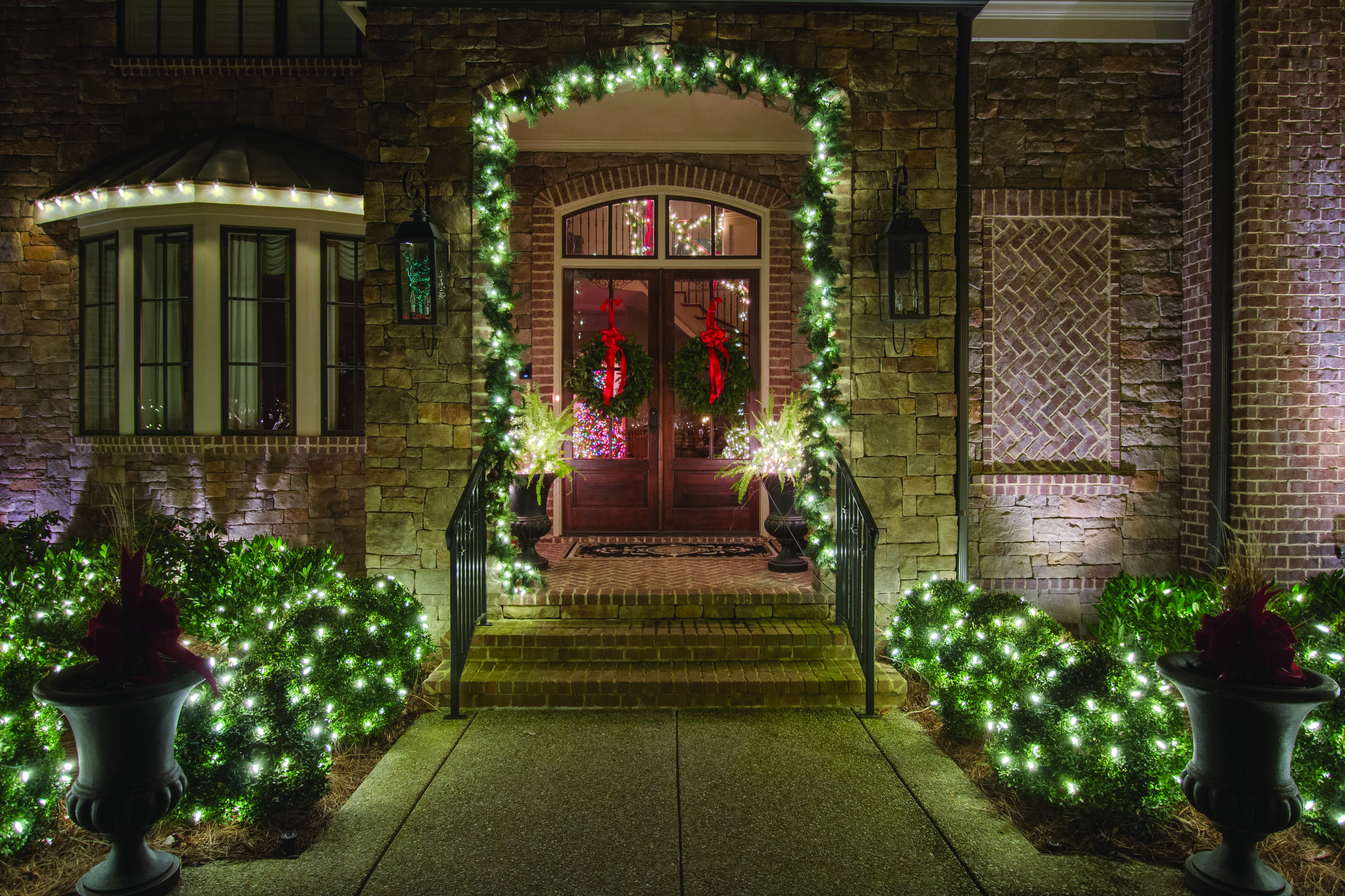 close up of front door decorated for christmas