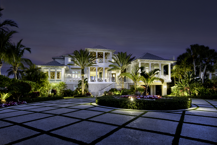 mansion with outdoor lighting
